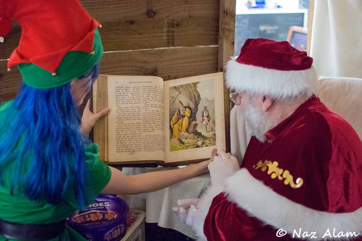 Colne Market Hall: Santa & His Elf reading The Pilgrims Progress